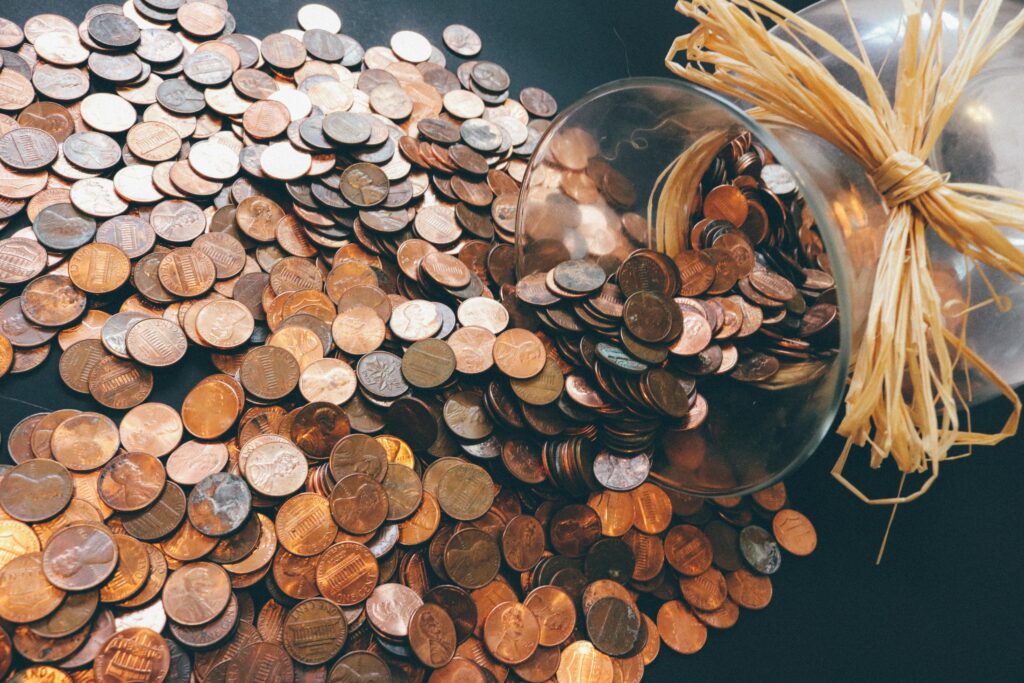 pennies being dumped out of a jar
